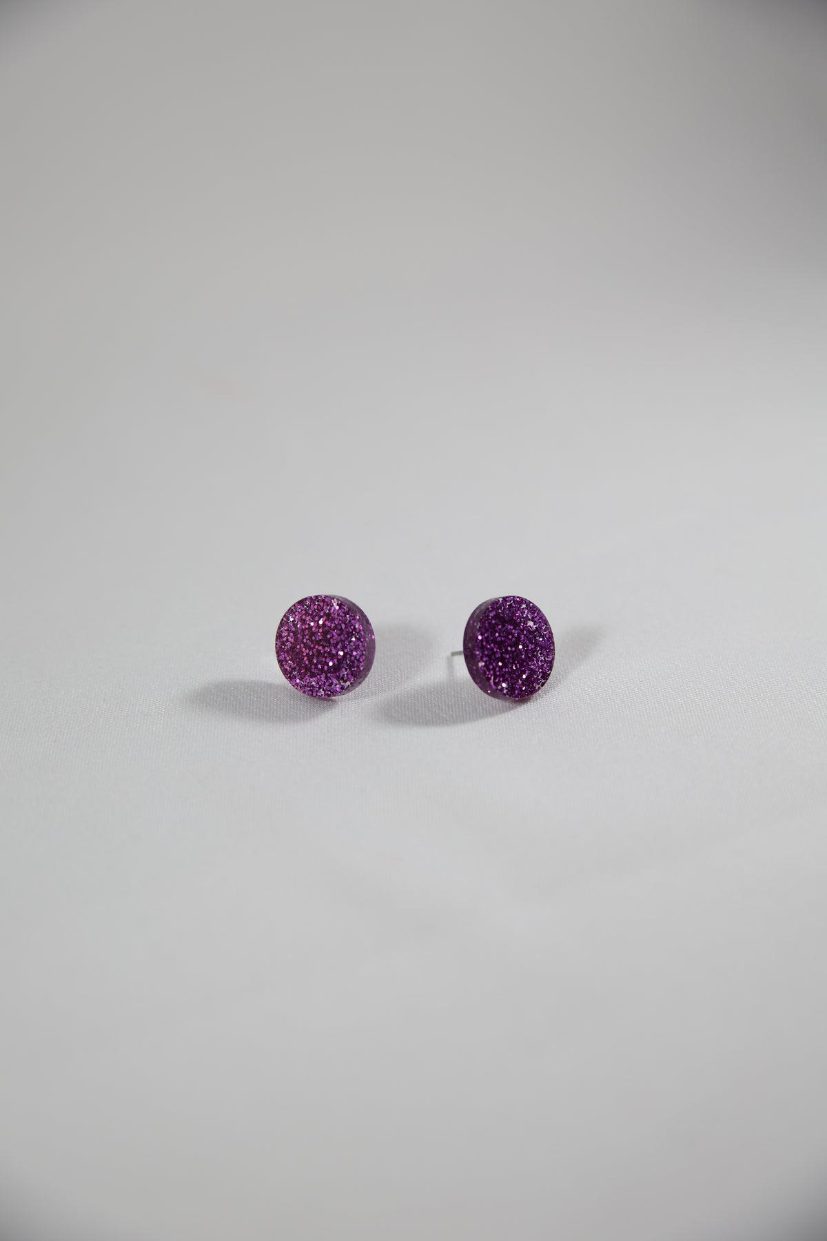 Nappikorvakorut Violetti Glitter